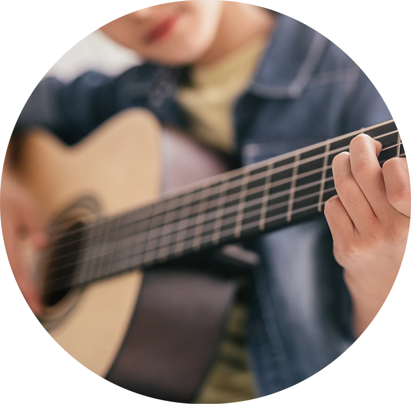 Student playing guitar